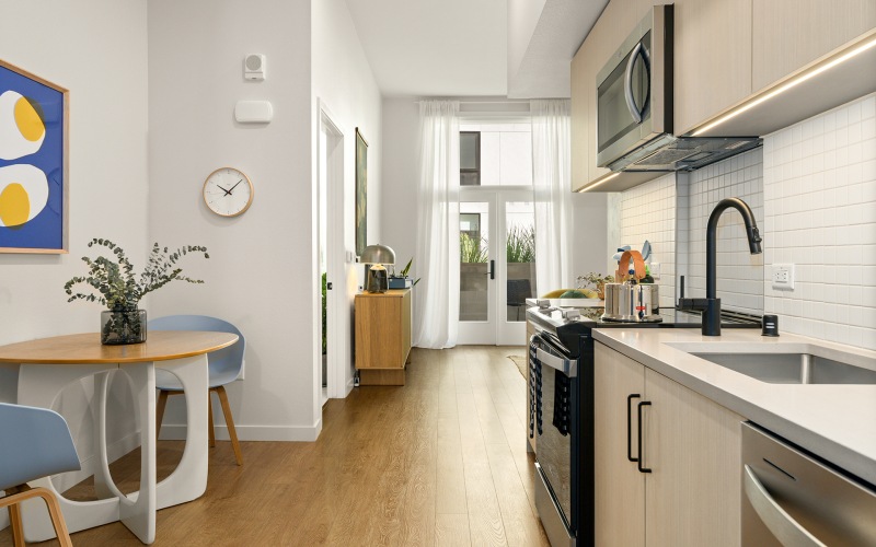 a kitchen with new finishes and a dining area