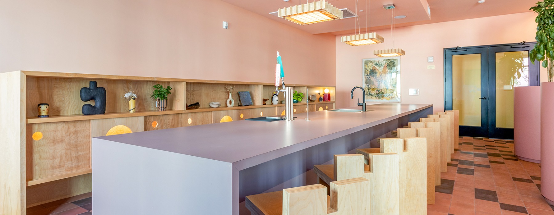 a resident lounge with taps and a sink and seating