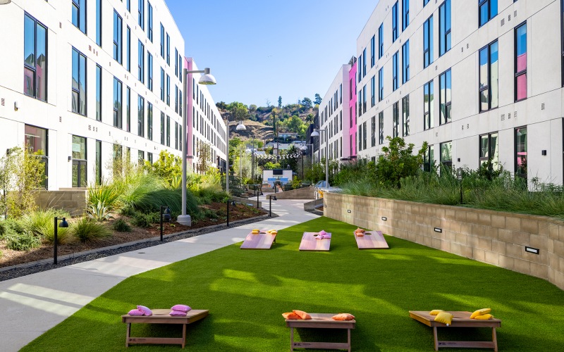 an outdoor courtyard with lawn games