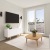 living room with a large window and tv