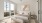 bedroom with a large window and bed