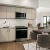 kitchen with stainless steel appliances, a table and chairs