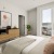 bedroom with a dresser, bedroom, and windows
